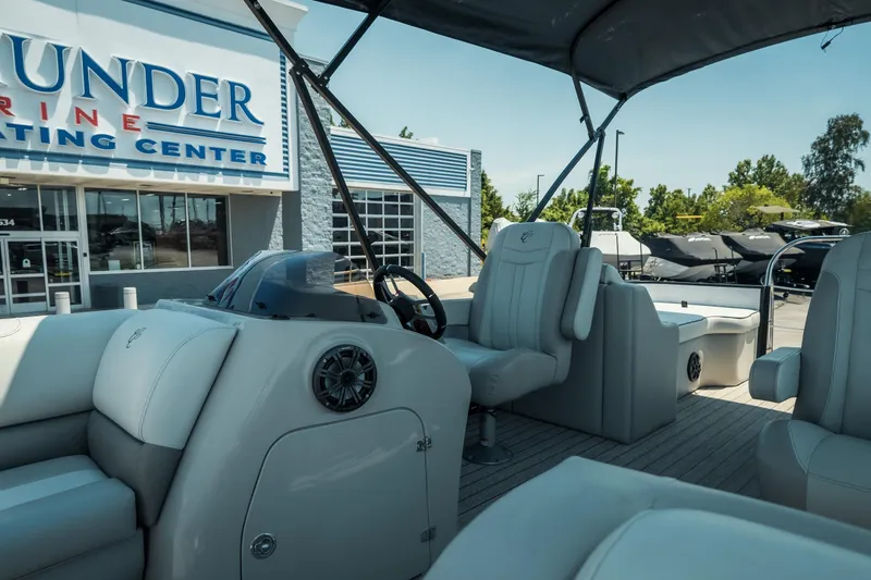 Slide: The Image of 2022 Cypress Cay Seabreeze 252 pontoon boat at a marine dealership. - 12