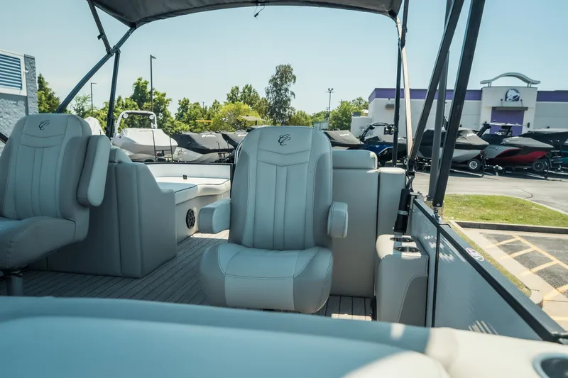 Slide: The Image of 2022 Cypress Cay Seabreeze 252 pontoon boat interior with plush seating and canopy. - 13