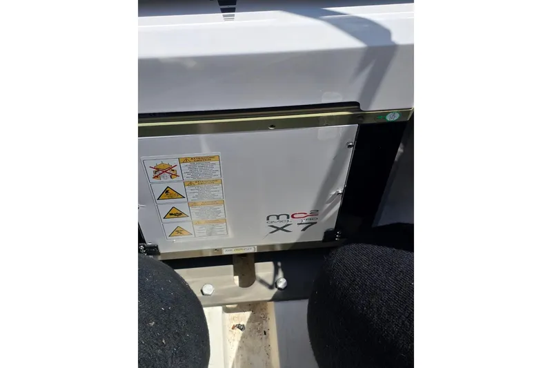 Slide: The Image of 2023 Solace 32CS boat component with warning labels and MC2 Quick gyro stabilizer. - 22