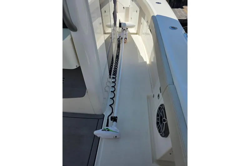 Slide: The Image of 2023 Solace 32CS boat deck with coiled cable and speaker detail. - 6