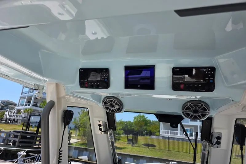 Slide: The Image of 2023 Solace 32CS boat interior with modern control panel and speakers. - 5