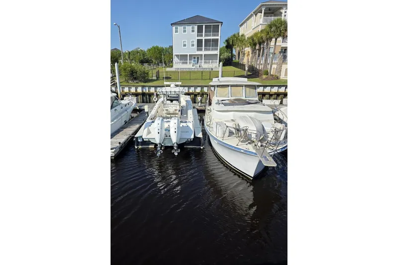 Slide: The Image of Boats docked at a marina, featuring a 2023 Solace 32CS model. - 2
