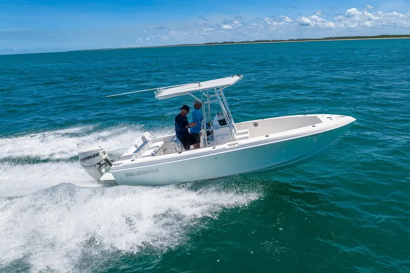 Slide: The Image of 2006 Bluewater 2150 CC boat cruising on open ocean waters. - 1