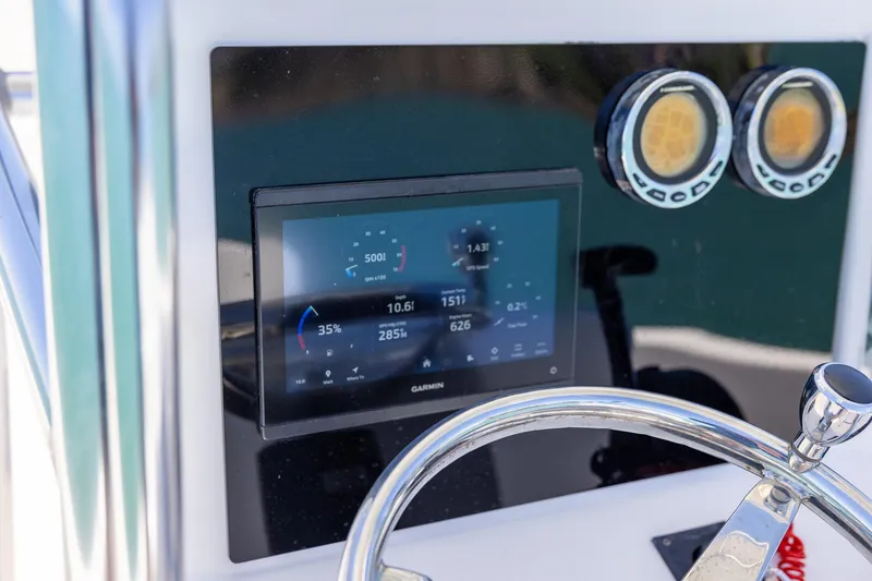 Slide: The Image of Control panel of a 2006 Bluewater 2150 CC boat with Garmin display. - 19