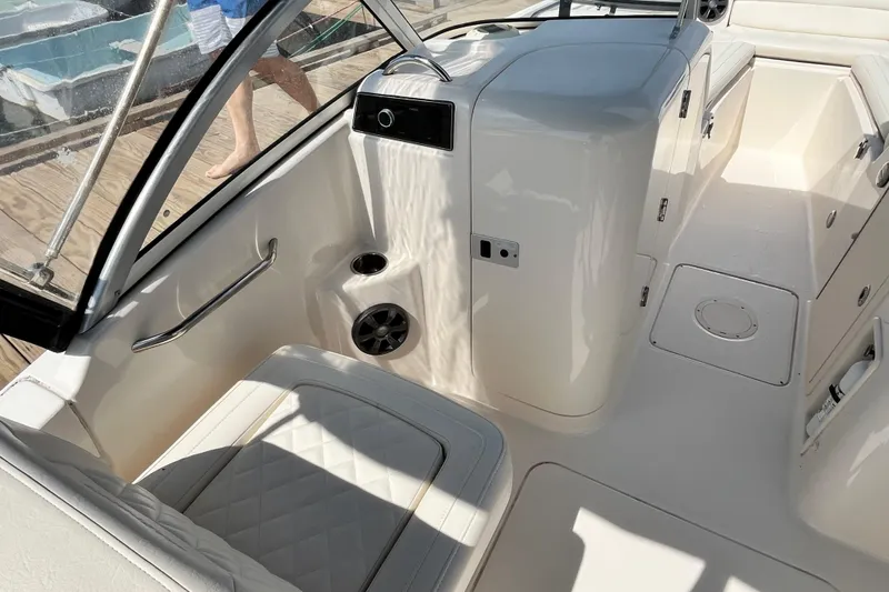Slide: The Image of 2021 Grady-White Freedom 215 boat interior with seating and storage compartments. - 15