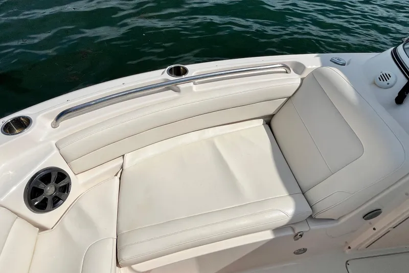 Slide: The Image of 2021 Grady-White Freedom 215 boat interior with white seating and cup holders. - 26