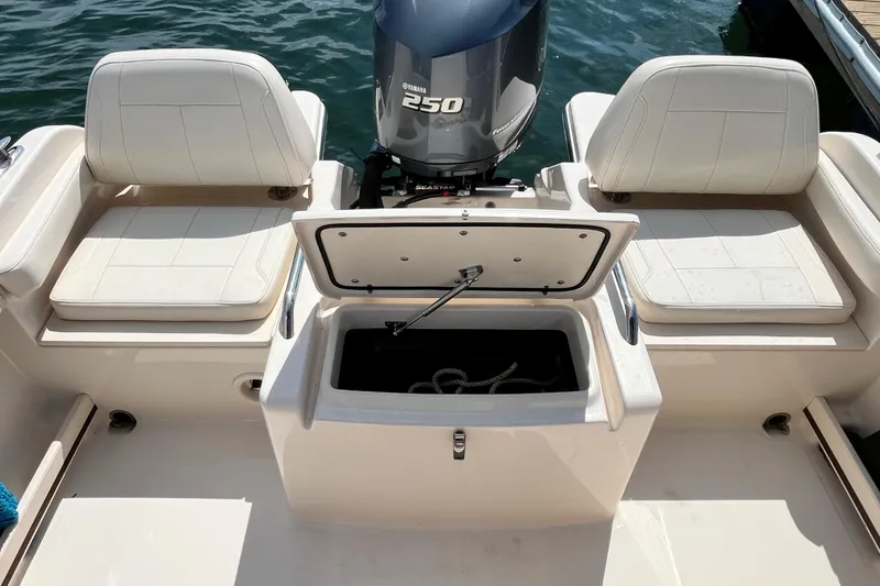 Slide: The Image of 2021 Grady-White Freedom 215 boat interior with Yamaha 250 engine and seating. - 10