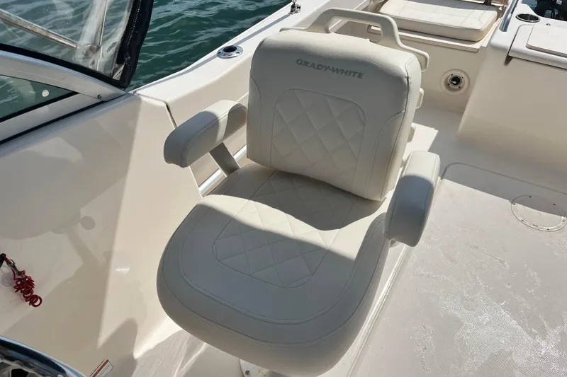 Slide: The Image of Grady-White Freedom 215 boat seat, 2021 model, featuring luxurious white upholstery. - 17