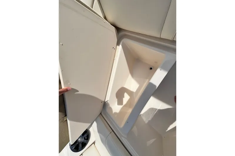 Slide: The Image of Open storage compartment on 2021 Grady-White Freedom 215 boat, showcasing interior space. - 32