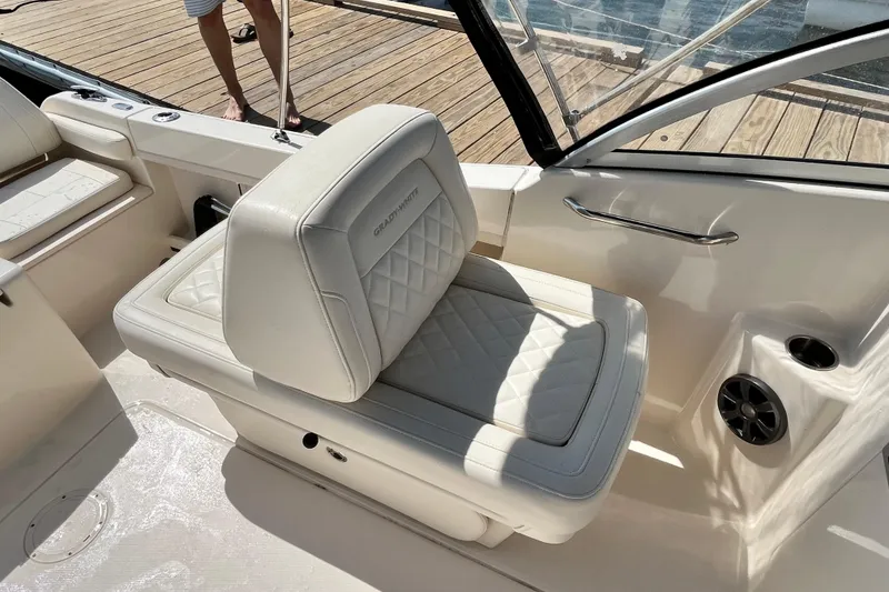 Slide: The Image of 2021 Grady-White Freedom 215 boat interior with cushioned seating and sleek design. - 14