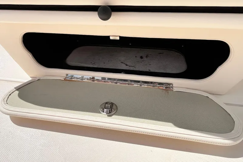 Slide: The Image of Open storage compartment on a 2021 Grady-White Freedom 215 boat. - 31