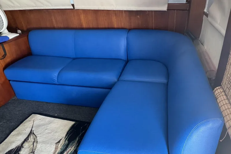 Slide: The Image of Blue sofa in the cabin of a 1991 Ocean Yachts 35 Super Sport. - 7