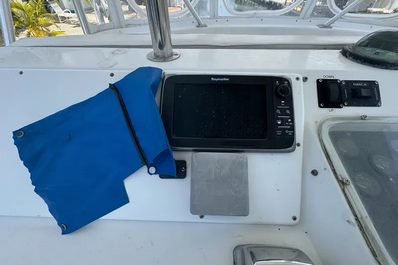 Slide: The Image of Control panel of a 1991 Ocean Yachts 35 Super Sport with navigation equipment. - 19