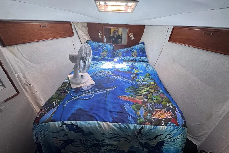 Slide: The Image of Cozy cabin interior of 1991 Ocean Yachts 35 Super Sport with vibrant marine-themed bedding. - 59