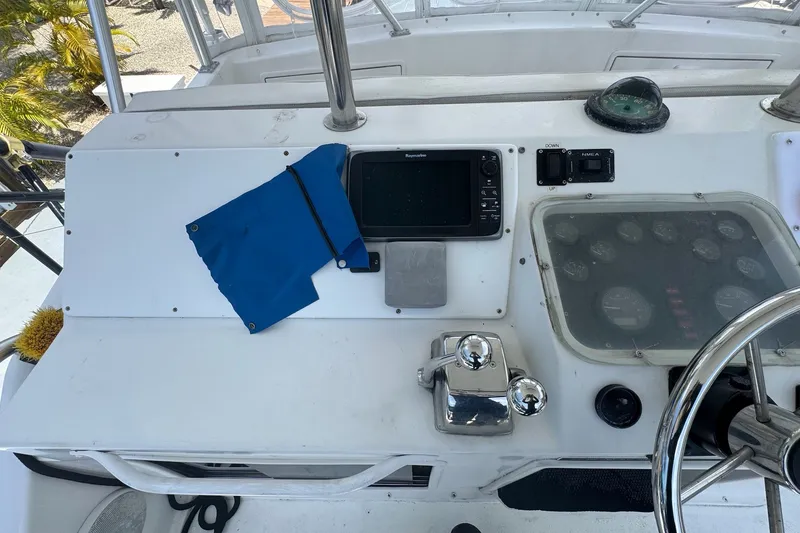 Slide: The Image of 1991 Ocean Yachts 35 Super Sport helm with navigation equipment and steering wheel. - 29