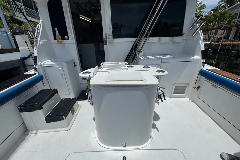 Slide: The Image of 1991 Ocean Yachts 35 Super Sport boat deck with fishing gear and seating area. - 10
