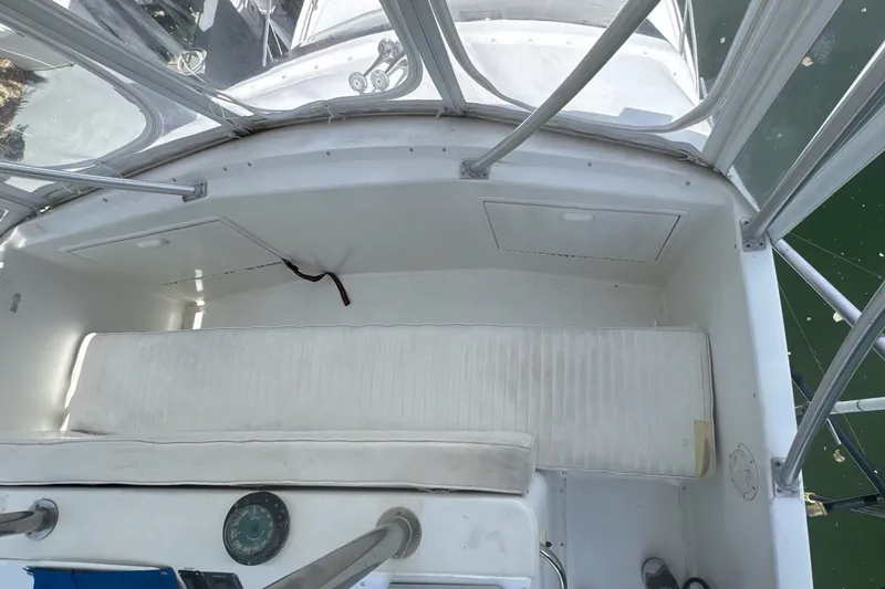 Slide: The Image of The image shows the cockpit of a 1991 Ocean Yachts 35 Super Sport with white cushions. - 22