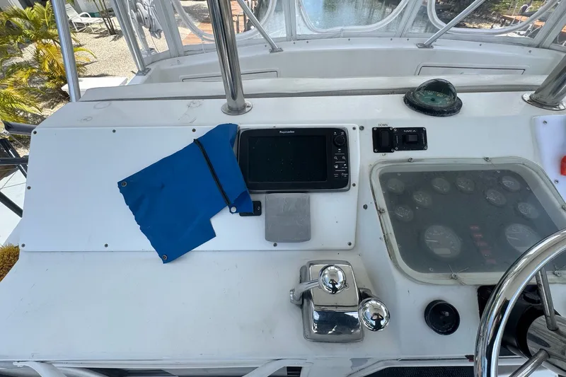 Slide: The Image of 1991 Ocean Yachts 35 Super Sport helm with navigation equipment and controls. - 28