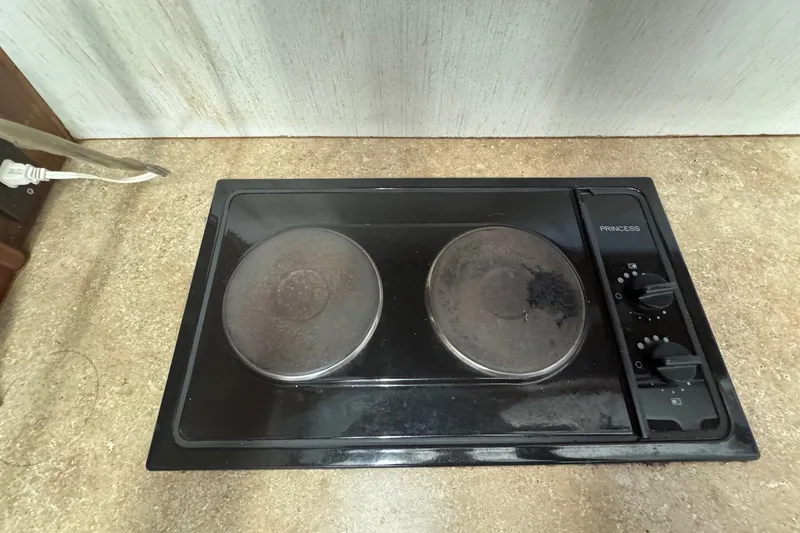 Slide: The Image of Electric stove with dual burners on Ocean Yachts 1991 35 Super Sport. - 46