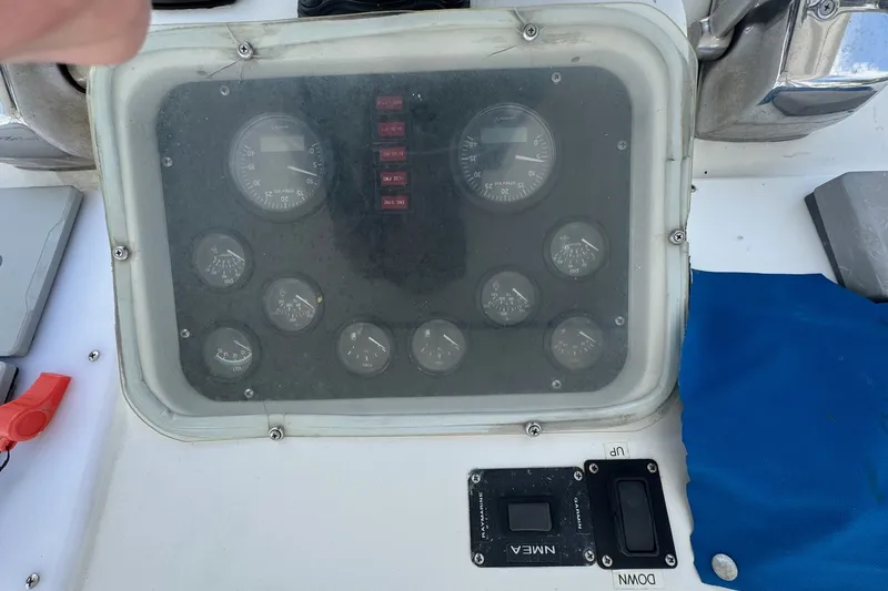 Slide: The Image of 1991 Ocean Yachts 35 Super Sport dashboard with gauges and controls. - 20