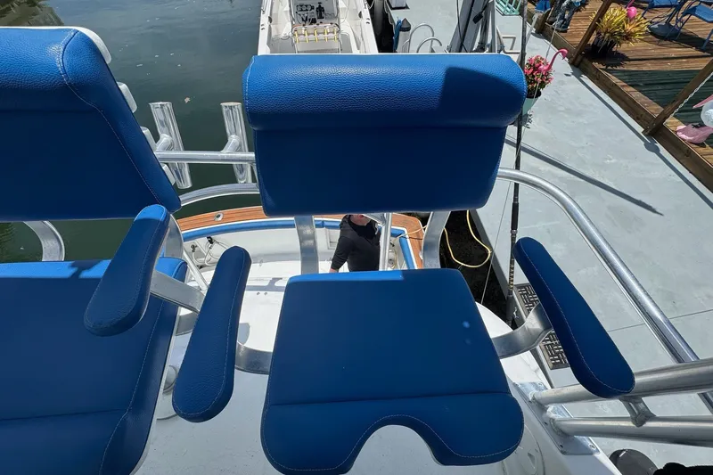 Slide: The Image of Blue seating on 1991 Ocean Yachts 35 Super Sport boat, dockside view. - 26