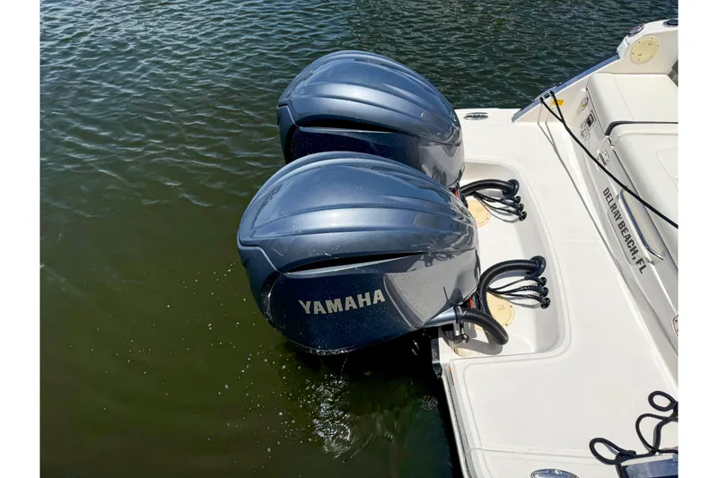Slide: The Image of 2023 Chaparral 280 OSX with dual Yamaha outboard motors on water. - 85