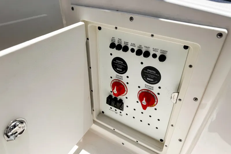 Slide: The Image of Control panel of 2023 Chaparral 280 OSX boat with switches and dials. - 17