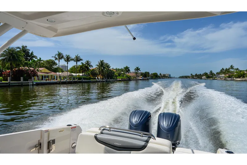 Slide: The Image of 2023 Chaparral 280 OSX cruising on a scenic tropical waterway. - 88