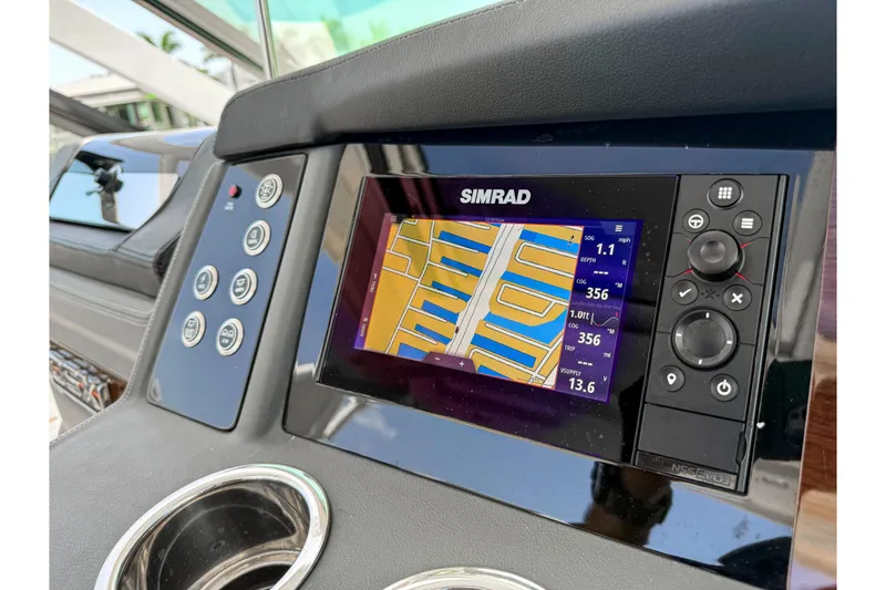 Slide: The Image of Dashboard of 2023 Chaparral 280 OSX featuring Simrad navigation system. - 61