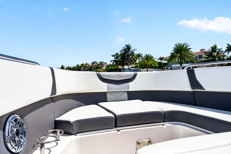 Slide: The Image of 2023 Chaparral 280 OSX boat interior with luxurious seating and coastal view. - 34