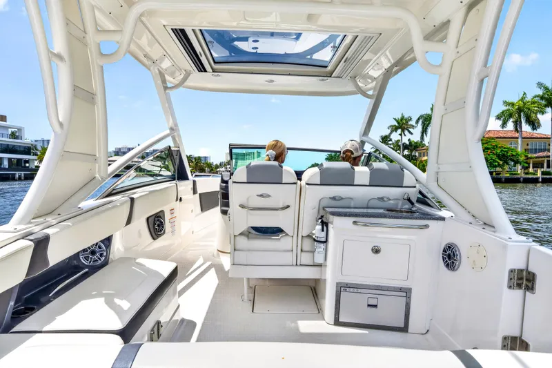 Slide: The Image of 2023 Chaparral 280 OSX boat interior with seating and water view. - 16