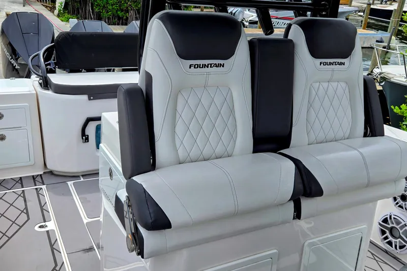 Slide: The Image of 2024 Fountain 32 NX Sportfish boat seats with diamond stitching and black accents. - 37