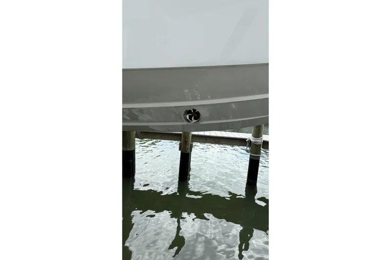 Slide: The Image of 2024 Fountain 32 NX Sportfish boat hull above water at dock. - 28