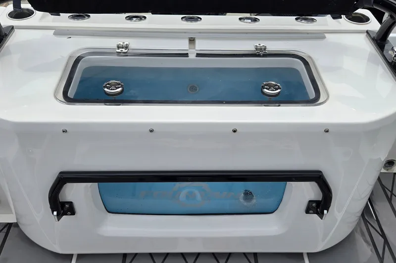 Slide: The Image of 2024 Fountain 32 NX Sportfish livewell with sleek design and stainless steel fixtures. - 15