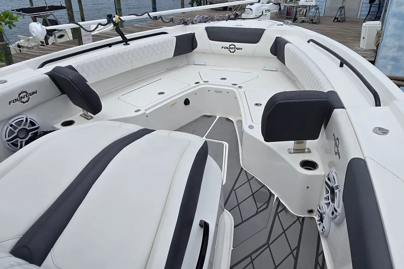 Slide: The Image of 2024 Fountain 32 NX Sportfish boat interior with cushioned seating and modern design. - 32
