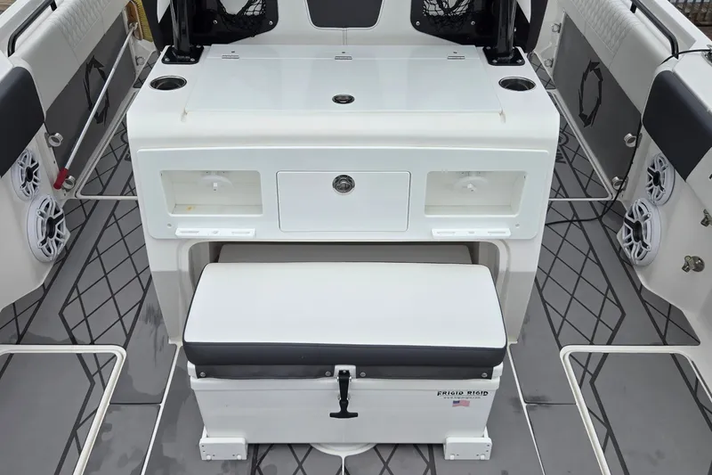 Slide: The Image of 2024 Fountain 32 NX Sportfish boat interior with seating and storage compartments. - 17