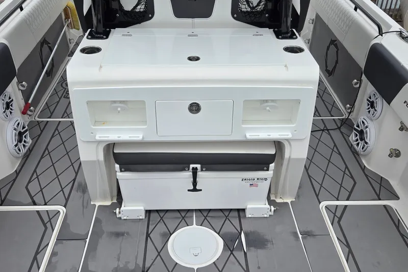 Slide: The Image of 2024 Fountain 32 NX Sportfish boat interior with storage and seating area. - 18