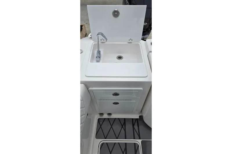 Slide: The Image of 2024 Fountain 32 NX Sportfish boat sink and storage area. - 22