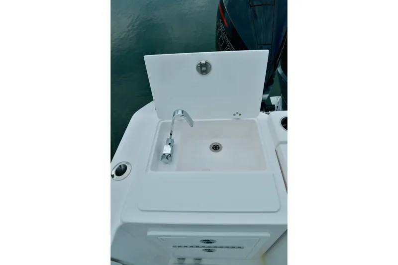 Slide: The Image of 2024 Fountain 32 NX Sportfish boat sink with faucet, featuring a sleek design. - 21
