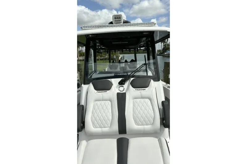 Slide: The Image of 2024 Fountain 32 NX Sportfish boat with luxurious seating and sleek design. - 29