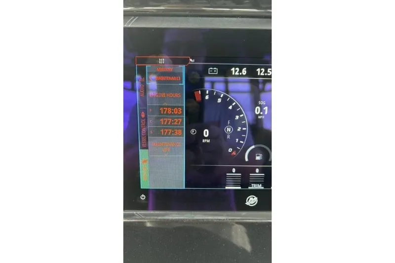 Slide: The Image of Dashboard display of 2024 Fountain 32 NX Sportfish showing engine hours and RPM gauge. - 49