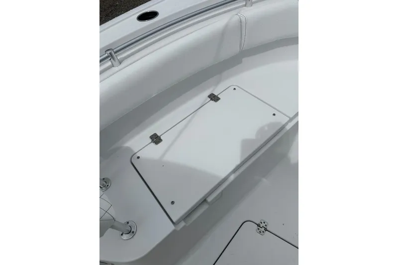 Slide: The Image of 2026 Sportsman Open 232 Center Console boat interior with storage compartment. - 28