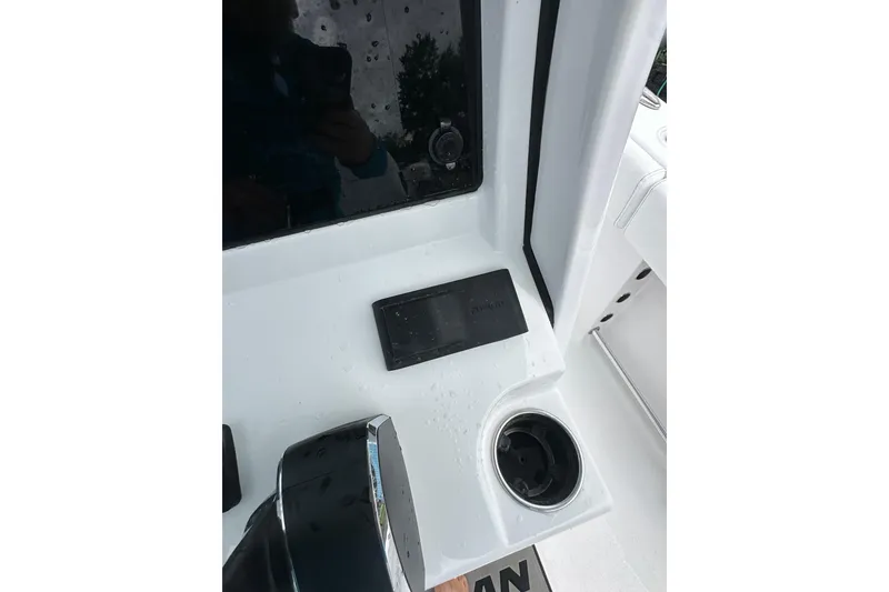 Slide: The Image of 2026 Sportsman Open 232 Center Console dashboard with cup holder and control panel. - 41