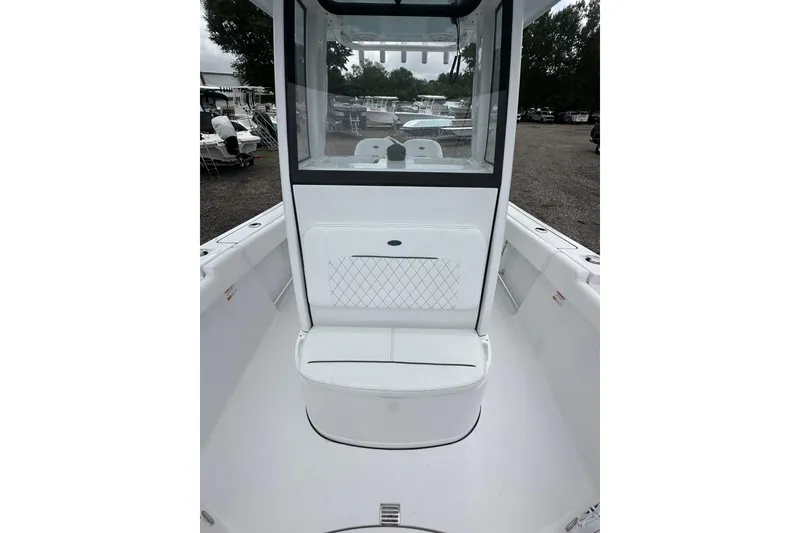Slide: The Image of 2026 Sportsman Open 232 Center Console boat interior with seating and console view. - 21