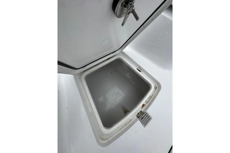 Slide: The Image of Open storage compartment on 2026 Sportsman Open 232 Center Console boat. - 23