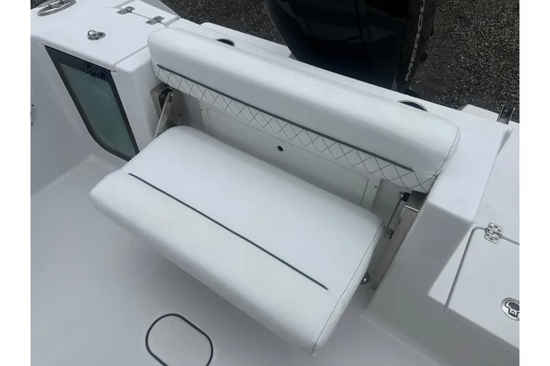 Slide: The Image of 2026 Sportsman Open 232 Center Console boat seat with white cushioned design. - 16