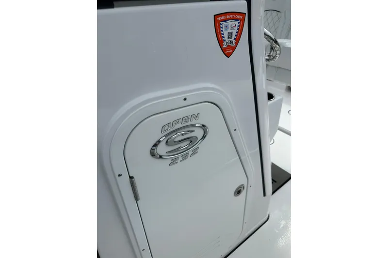 Slide: The Image of 2026 Sportsman Open 232 Center Console boat with vessel safety check sticker. - 32