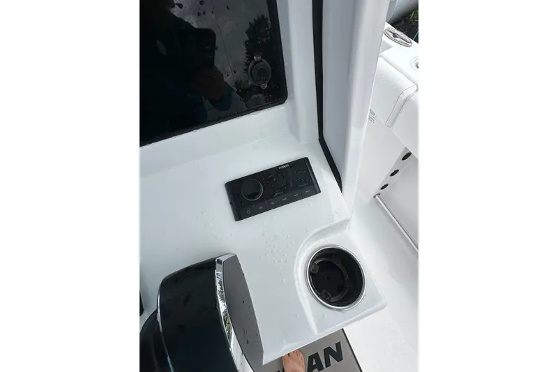 Slide: The Image of 2026 Sportsman Open 232 Center Console dashboard with control panel and cup holder. - 40