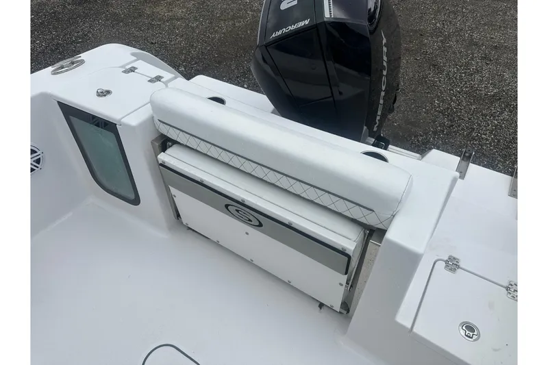 Slide: The Image of 2026 Sportsman Open 232 Center Console boat interior with seating and Mercury engine. - 15