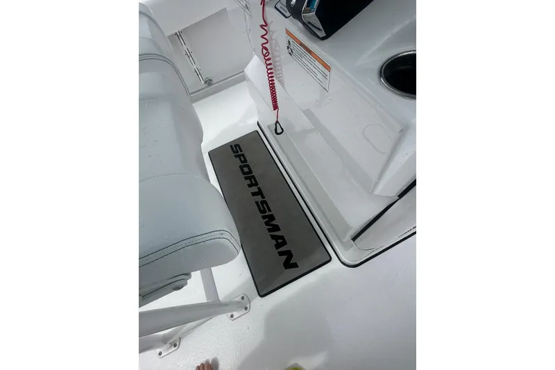 Slide: The Image of 2026 Sportsman Open 232 Center Console interior with branded mat and seating. - 20